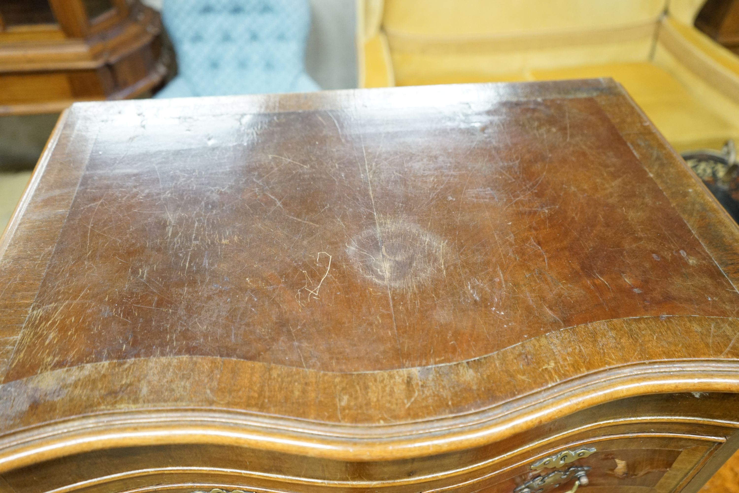 A reproduction 18th century style serpentine walnut tall chest fitted slide, width 66cm, depth 43cm, height 134cm